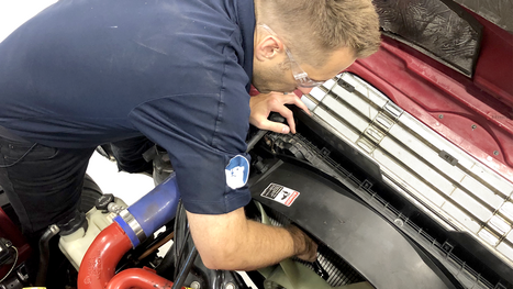 Upgrade engine cooling system Freightliner M2 mechanic working on truck 