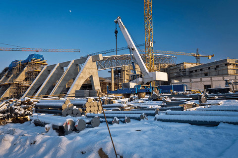 A side view of a lumberyard during the winter